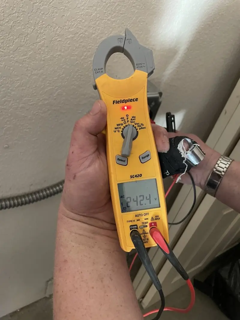 Voltage testing with clamp meter during Ceiling Fan Installation in Sully Square